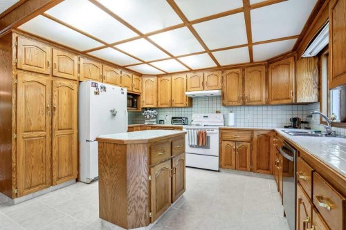 208 Hawkview Manor Place Nw, Calgary, AB - Indoor Photo Showing Kitchen With Double Sink