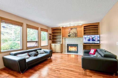 208 Hawkview Manor Place Nw, Calgary, AB - Indoor Photo Showing Living Room With Fireplace