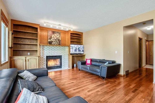 208 Hawkview Manor Place Nw, Calgary, AB - Indoor Photo Showing Living Room With Fireplace