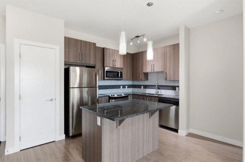 306-4 Sage Hill Terrace Nw, Calgary, AB - Indoor Photo Showing Kitchen With Upgraded Kitchen