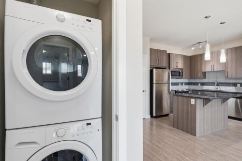 306-4 Sage Hill Terrace Nw, Calgary, AB - Indoor Photo Showing Laundry Room