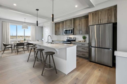 223 Waterford Heights, Chestermere, AB - Indoor Photo Showing Kitchen With Upgraded Kitchen