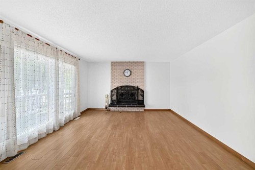351 Cedarpark Drive Sw, Calgary, AB - Indoor Photo Showing Living Room