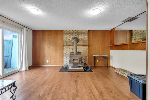 28 Macewan Meadow Link Nw, Calgary, AB - Indoor Photo Showing Other Room With Fireplace