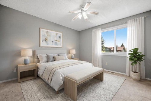 125 Carr Place, Okotoks, AB - Indoor Photo Showing Bedroom