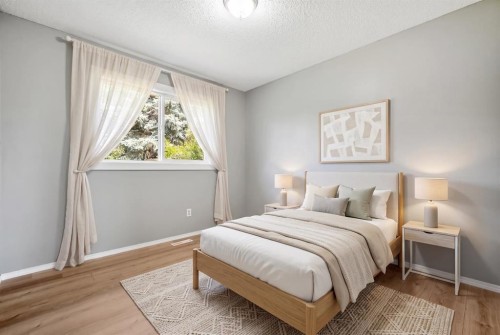 125 Carr Place, Okotoks, AB - Indoor Photo Showing Bedroom