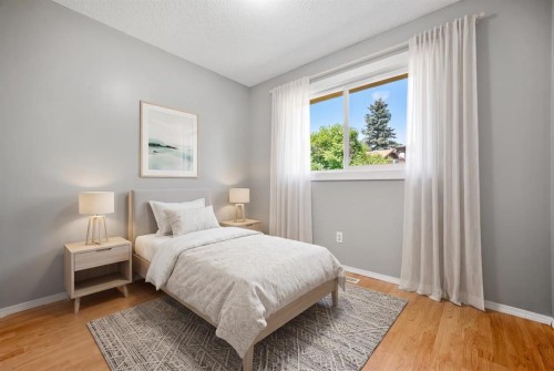 125 Carr Place, Okotoks, AB - Indoor Photo Showing Bedroom