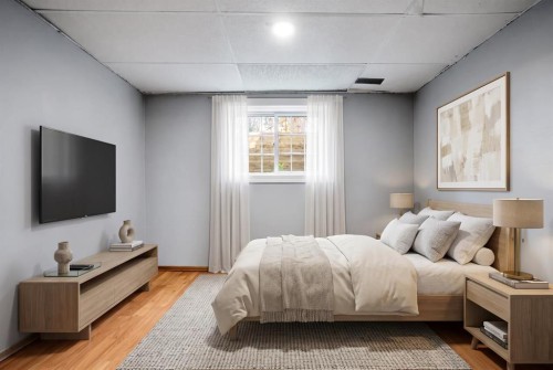 125 Carr Place, Okotoks, AB - Indoor Photo Showing Bedroom