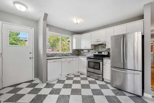 125 Carr Place, Okotoks, AB - Indoor Photo Showing Kitchen With Stainless Steel Kitchen