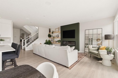 1129 Cranbrook Gardens Se, Calgary, AB - Indoor Photo Showing Living Room With Fireplace