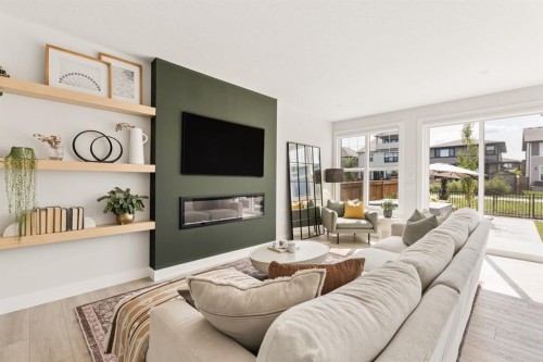 1129 Cranbrook Gardens Se, Calgary, AB - Indoor Photo Showing Living Room With Fireplace