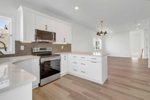 9 Ian Way, Sylvan Lake, AB - Indoor Photo Showing Kitchen With Stainless Steel Kitchen With Upgraded Kitchen