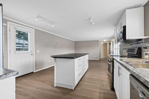 197 Spring Dale Circle Se, Airdrie, AB - Indoor Photo Showing Kitchen With Double Sink