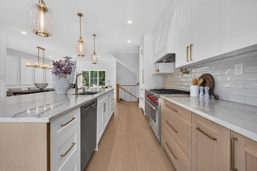88 Woodlark Drive Sw, Calgary, AB - Indoor Photo Showing Kitchen With Upgraded Kitchen