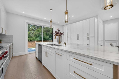 88 Woodlark Drive Sw, Calgary, AB - Indoor Photo Showing Kitchen With Double Sink With Upgraded Kitchen