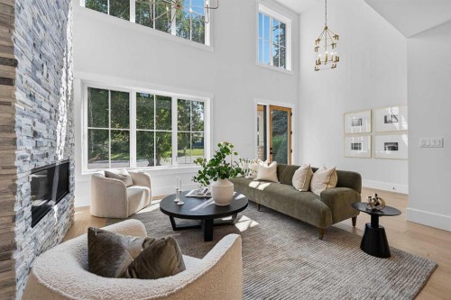 88 Woodlark Drive Sw, Calgary, AB - Indoor Photo Showing Living Room With Fireplace
