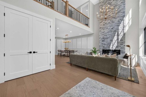 88 Woodlark Drive Sw, Calgary, AB - Indoor Photo Showing Other Room With Fireplace