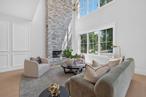 88 Woodlark Drive Sw, Calgary, AB - Indoor Photo Showing Living Room With Fireplace