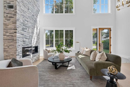 88 Woodlark Drive Sw, Calgary, AB - Indoor Photo Showing Living Room With Fireplace