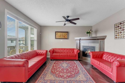 130 Brightonwoods Grove Se, Calgary, AB - Indoor Photo Showing Living Room With Fireplace