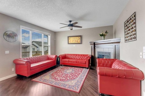 130 Brightonwoods Grove Se, Calgary, AB - Indoor Photo Showing Living Room With Fireplace