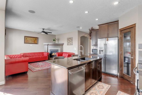 130 Brightonwoods Grove Se, Calgary, AB - Indoor Photo Showing Kitchen With Fireplace With Double Sink With Upgraded Kitchen