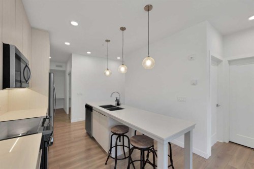 2101-76 Cornerstone Passage Ne, Calgary, AB - Indoor Photo Showing Kitchen With Double Sink With Upgraded Kitchen