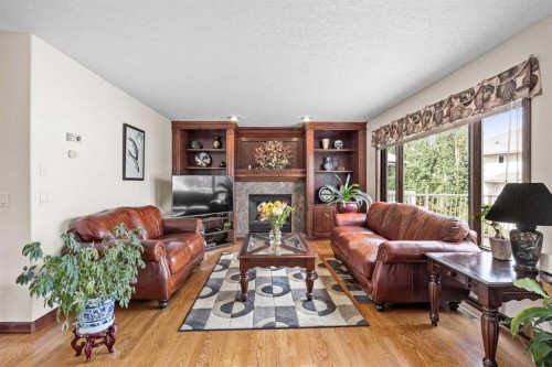 10385 Hamptons Boulevard Nw, Calgary, AB - Indoor Photo Showing Living Room With Fireplace