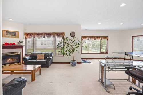 10385 Hamptons Boulevard Nw, Calgary, AB - Indoor Photo Showing Living Room With Fireplace