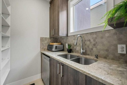 244 Sandpiper Boulevard, Chestermere, AB - Indoor Photo Showing Kitchen With Double Sink