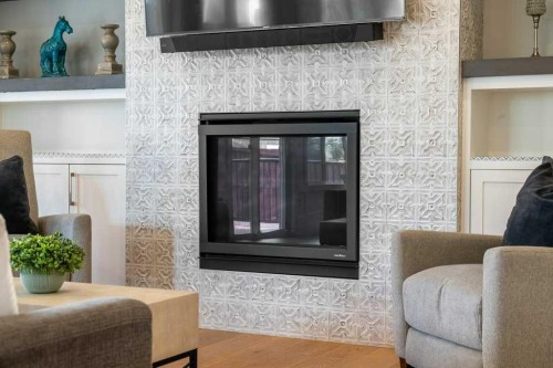 244 Sandpiper Boulevard, Chestermere, AB - Indoor Photo Showing Living Room With Fireplace
