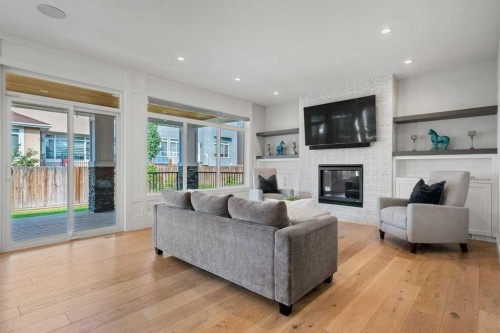 244 Sandpiper Boulevard, Chestermere, AB - Indoor Photo Showing Living Room With Fireplace