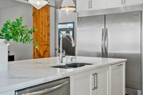 244 Sandpiper Boulevard, Chestermere, AB - Indoor Photo Showing Kitchen With Double Sink With Upgraded Kitchen