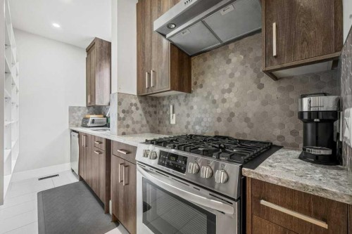 244 Sandpiper Boulevard, Chestermere, AB - Indoor Photo Showing Kitchen With Upgraded Kitchen