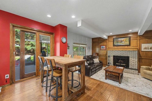 75 Deerbrook Road Se, Calgary, AB - Indoor With Fireplace