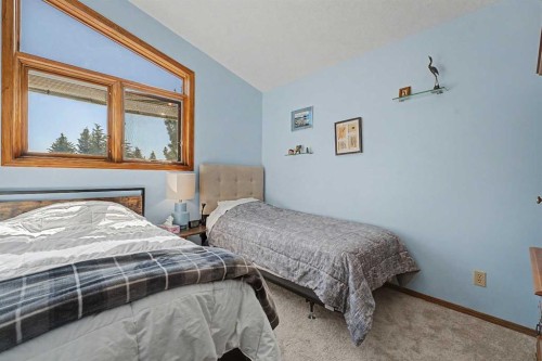 75 Deerbrook Road Se, Calgary, AB - Indoor Photo Showing Bedroom
