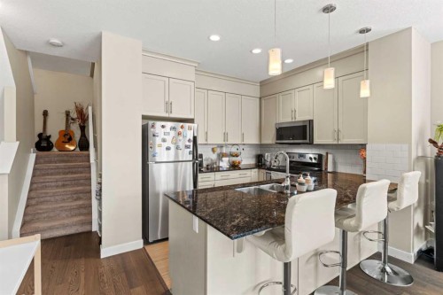 130 Silverado Plains Park Sw, Calgary, AB - Indoor Photo Showing Kitchen With Double Sink With Upgraded Kitchen