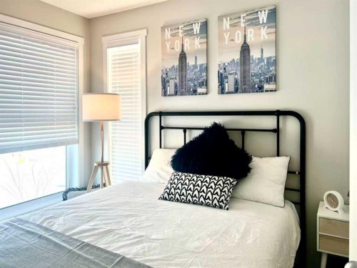 148 Carrington Boulevard Nw, Calgary, AB - Indoor Photo Showing Bedroom