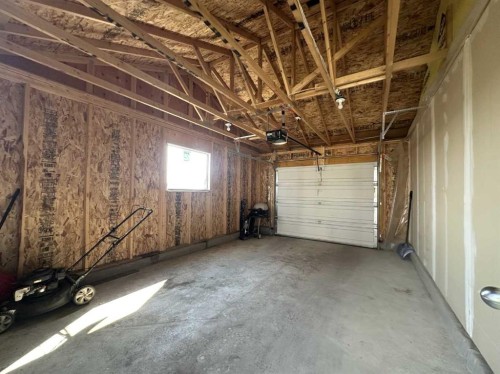 148 Carrington Boulevard Nw, Calgary, AB - Indoor Photo Showing Garage