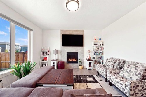 170 Chelsea Road, Chestermere, AB - Indoor Photo Showing Living Room With Fireplace