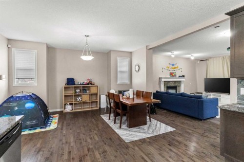 10 Nolanfield Heights Nw, Calgary, AB - Indoor Photo Showing Living Room With Fireplace