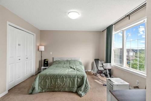 10 Nolanfield Heights Nw, Calgary, AB - Indoor Photo Showing Bedroom