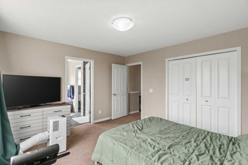 10 Nolanfield Heights Nw, Calgary, AB - Indoor Photo Showing Bedroom
