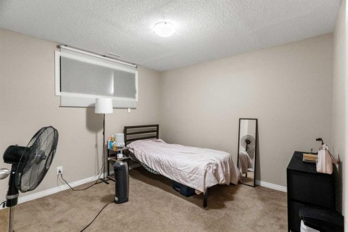 10 Nolanfield Heights Nw, Calgary, AB - Indoor Photo Showing Bedroom