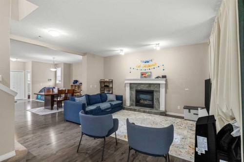 10 Nolanfield Heights Nw, Calgary, AB - Indoor Photo Showing Living Room With Fireplace
