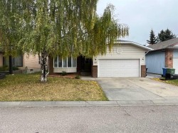 12 Woodmont Rise SW Calgary, AB T2W 4L3