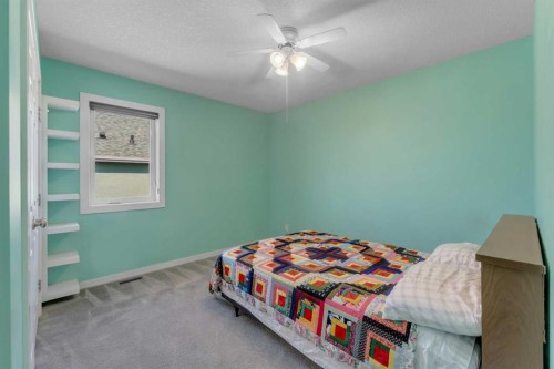 353 Kinniburgh Boulevard, Chestermere, AB - Indoor Photo Showing Bedroom