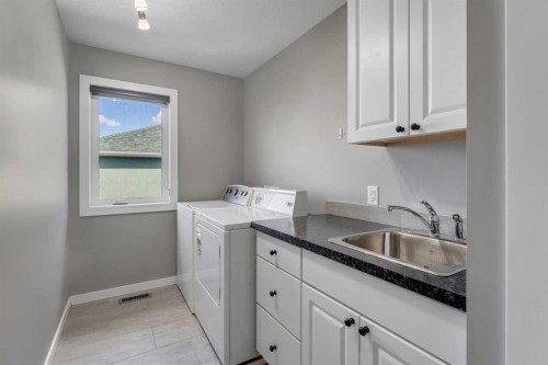 353 Kinniburgh Boulevard, Chestermere, AB - Indoor Photo Showing Laundry Room