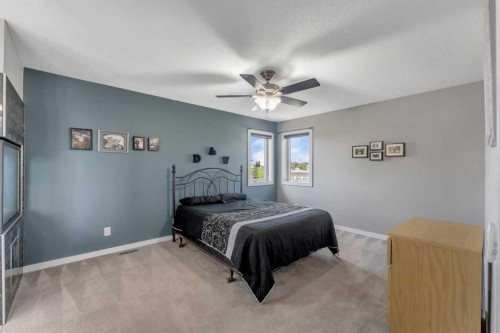 353 Kinniburgh Boulevard, Chestermere, AB - Indoor Photo Showing Bedroom
