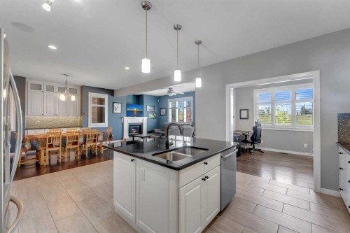 353 Kinniburgh Boulevard, Chestermere, AB - Indoor Photo Showing Kitchen With Double Sink With Upgraded Kitchen